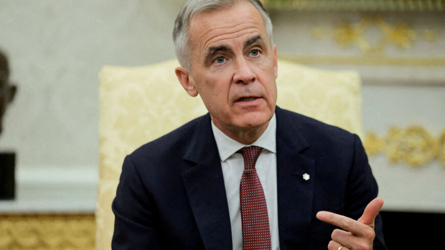 FILE PHOTO: Canadian Prime Minister Mark Carney speaks as he and U.S. President Donald Trump (not pictured) meet in the Oval Office at the White House in Washington, D.C., U.S., October 7, 2025. REUTERS/Evelyn Hockstein/File Photo