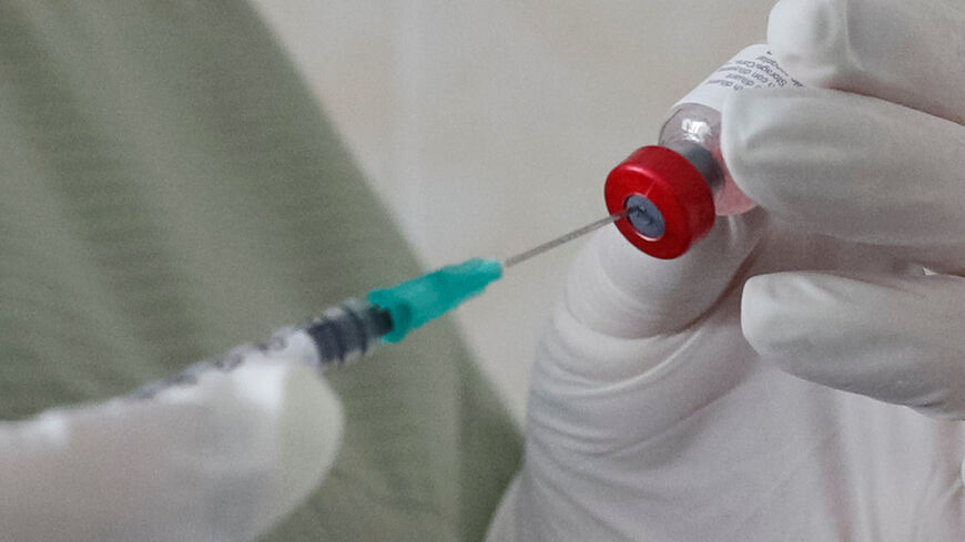 A nurse fills a syringe with a vaccine before administering an injection at a kids clinic in Kiev, Ukraine August 14, 2019. Picture taken August 14, 2019.  REUTERS/Valentyn Ogirenko