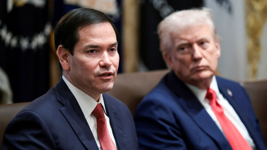 U.S. President Donald Trump listens as Secretary of State Marco Rubio speaks during a cabinet meeting at the White House, in Washington, D.C., U.S., October 9, 2025. REUTERS/Evelyn Hockstein