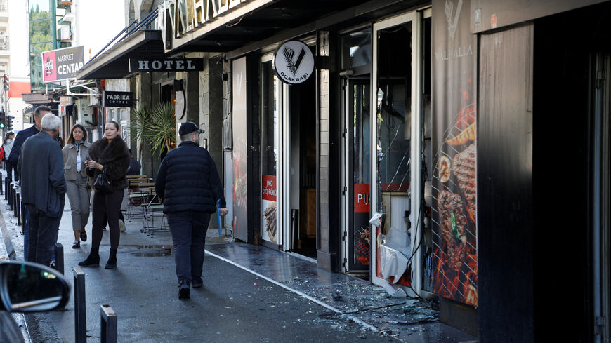 People walk past a demolished Turkish owned restaurant in downtown after, a man was stabbed and wounded in a late-night incident in Podgorica, Montenegro, October 27, 2025. REUTERS/Stevo Vasiljevic