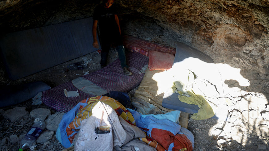 A boy walks at the site where Israeli forces killed three Palestinians, near Jenin, in the Israeli occupied West Bank October 28, 2025. REUTERS/Raneen Sawafta