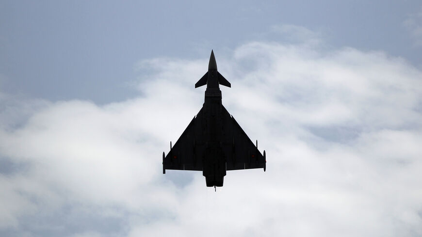 A Eurofighter Typhoon fighter jet flies vertically over a beach during an airshow in Torre del Mar, southern Spain, July 31, 2016. REUTERS/Jon Nazca