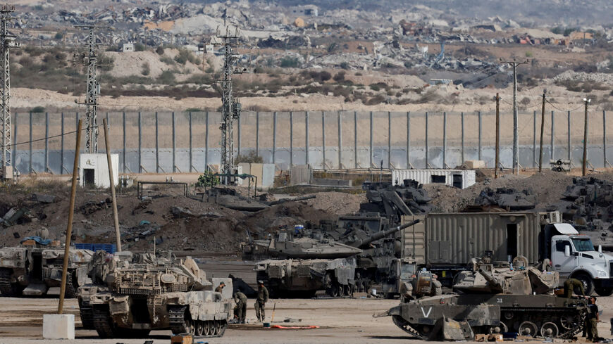 Israeli military personnel operate on the Israeli side of the Israel-Gaza border, on the day the Israeli military said it had resumed enforcing the Gaza ceasefire agreement after a series of strikes across the Gaza Strip, in southern Israel, October 29, 2025. REUTERS/Ammar Awad