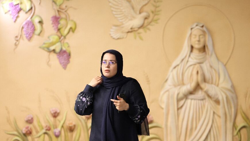 At Tehran's Maryam Moghaddas metro station religious frescoes and artworks honour Christianity's Virgin Mary, the mother of Christ