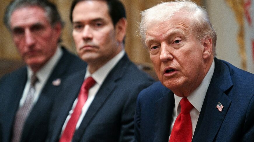 US President Donald Trump speaks alongside Secretary of the Interior Doug Burgum (L) and Secretary of State Marco Rubio (R) during a cabinet meeting in the Cabinet Room of the White House in Washington, DC, on October 9, 2025. Trump said Thursday he would try to go to Egypt for the signing of a Gaza ceasefire and hostage release deal between Israel and Hamas.
