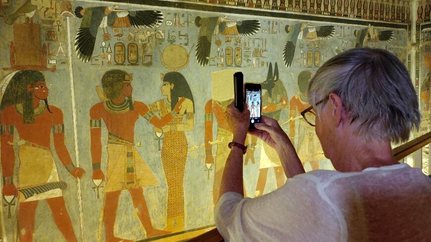 A tourist visits the tomb of Pharaoh Amenhotep III in the Valley of the Kings after the site was opened to the public