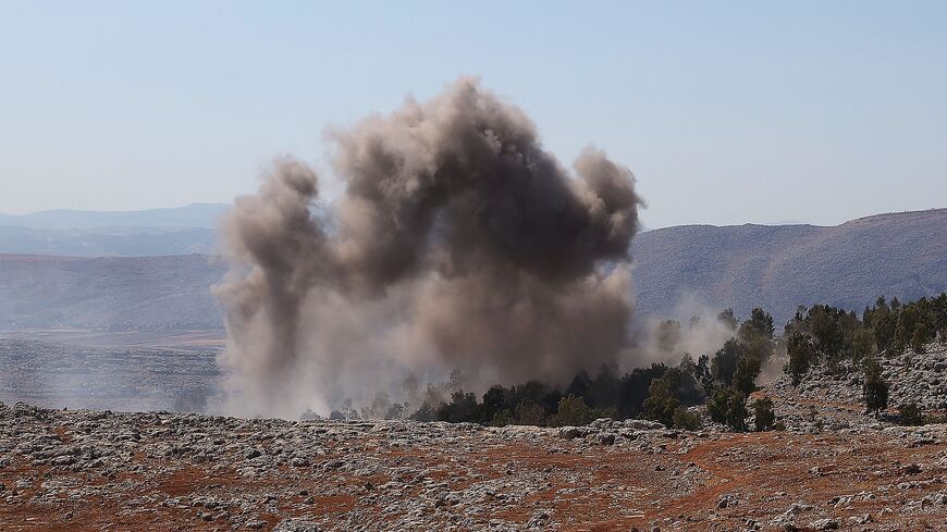 This picture taken on Aug. 20, 2021 shows a view of smoke rising from bombardment on the outskirts of Syria's rebel-held northwestern city of Idlib. 