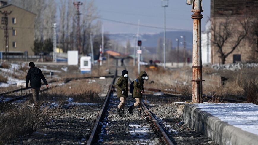 Several trucks carrying humanitarian aid cross the border between Armenia and Turkey at the village of Margara, Armenia, on March 21, 2025. 