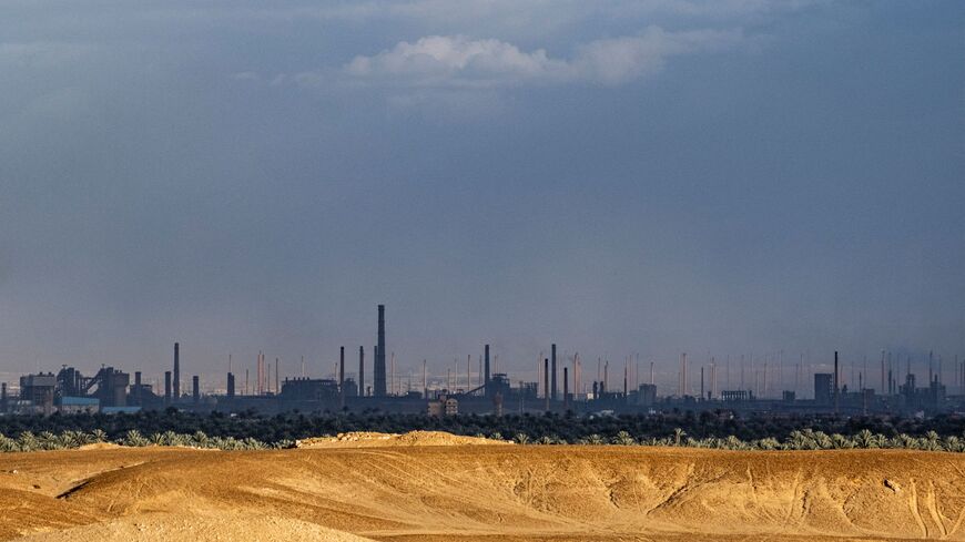 This picture taken on February 6, 2023 shows a view of Tibbin dual fuel (natural gas and fuel oil) powerplant and Helwan Steelworks, in the Helwan suburb south of Egypt's capital. (Photo by Amir MAKAR / AFP) (Photo by AMIR MAKAR/AFP via Getty Images)