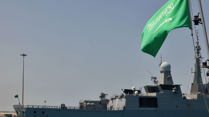 A Saudi navy ship is pictured docked at King Faisal navy base in Jeddah before the departure of a team to Port Sudan to help with the evacuation efforts of people fleeing Sudan, on April 29, 2023. - Warplanes on bombing raids drew heavy anti-aircraft fire over Khartoum as fierce fighting between Sudan's army and paramilitaries entered a third week, despite a renewed truce. (Photo by Fayez NURELDINE / AFP) (Photo by FAYEZ NURELDINE/AFP via Getty Images)