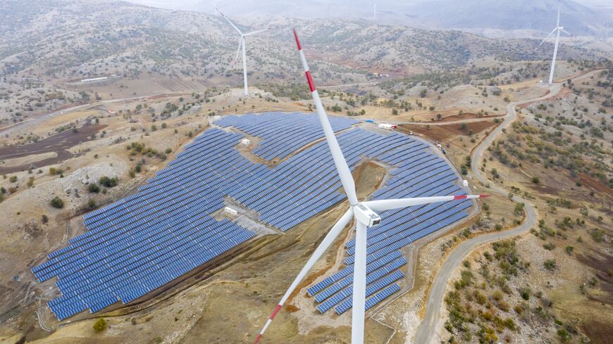 Aerial view of wind turbines and solar panel farm in Kayseri, Turkey. 