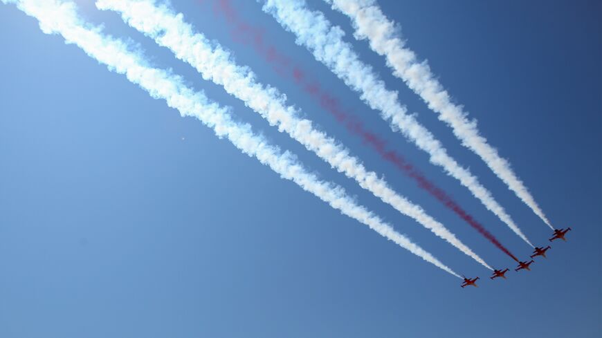 Turkish air force fighter jets fly over a parade during celebrations marking the 50th anniversary of Turkey's invasion of Cyprus on July 20, 2024, in occupied northern Nicosia, Cyprus.