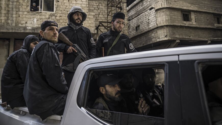Syria's internal security forces are deployed in Tadamon to secure a protest in Tadamon, Syria, on Feb. 7, 2025. 