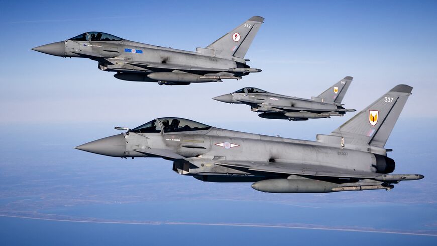Eurofighter jet fighters from the United Kingdom fly over the North Sea after being refueled by an MRTT aircraft coming from Eindhoven Air Base as part of the NATO exercise "Ramstein", near Eindhoven on April 2, 2025. 