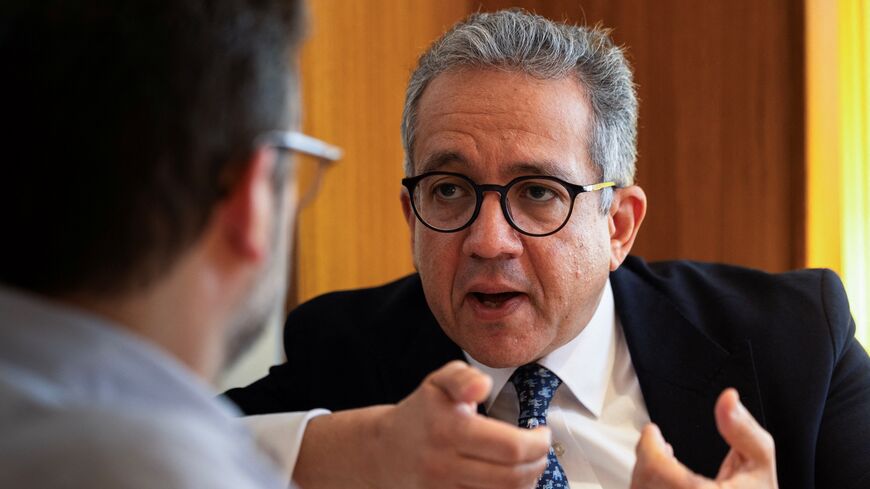 Khaled El-Enany, Egyptologist and former Minister of Tourism and Antiquities of Egypt, speaks during an interview with AFP at a hotel in Paris on April 10, 2025. 