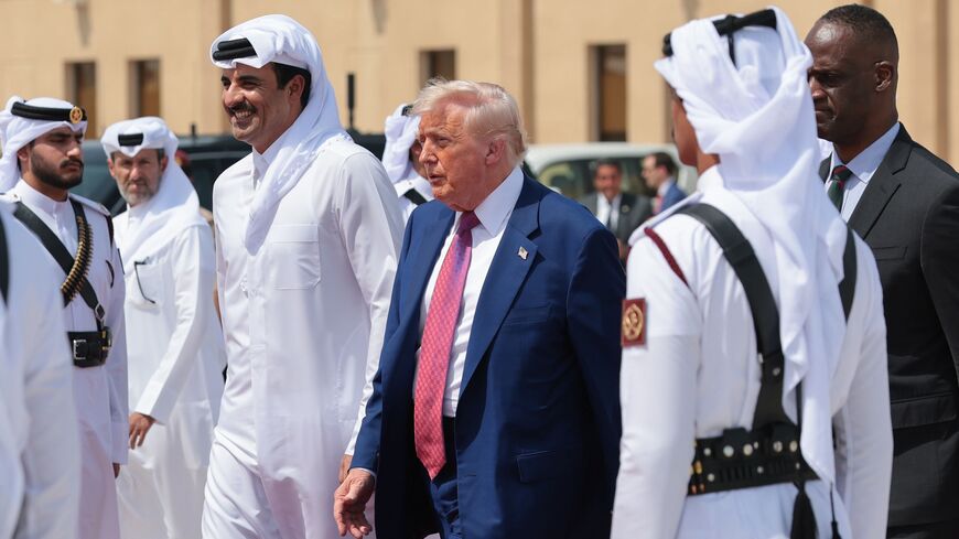 US President Donald J. Trump speaks with Emir of Qatar Sheikh Tamim bin Hamad Al Thani as he departs the Al Udeid Air Base for Abu Dhabi on May 15, 2025, in Doha, Qatar. 