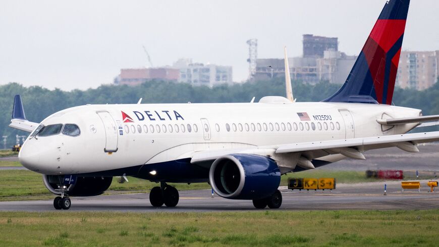 A Delta Air Lines Airbus A220 airplane prepares to takeoff at Ronald Reagan Washington National Airport in Arlington, Virginia, on July 10, 2025.
