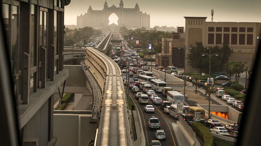  A picture taken from a station of Dubai's Palm Monorail, shows traffic on a road in Palm Jumeirah on August 28, 2025.