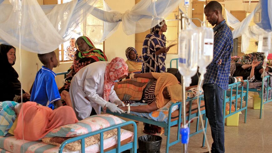 A nurse treats a Dengue fever patient at a hospital in Omdurman, west of the Sudanese capital, Khartoum, on Sept. 24, 2025. 