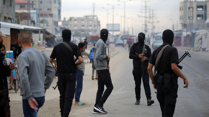 Members of the internal security forces loyal to the Palestinian group Hamas, man a checkpoint in the Nuseirat refugee camp in the central Gaza Strip, on Oct. 12, 2025. 