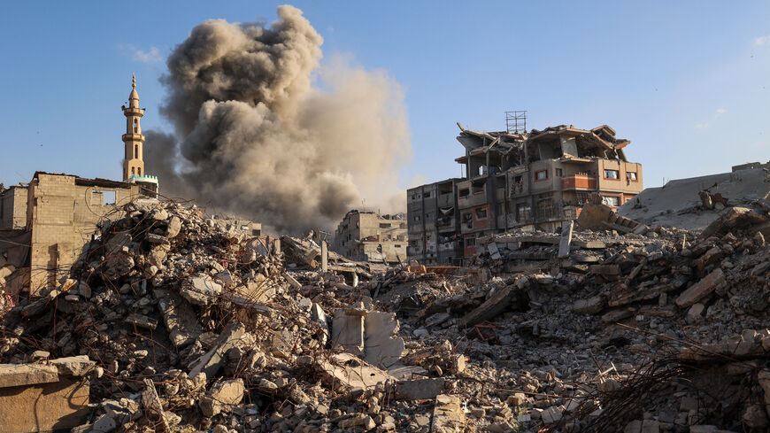 Smoke billows following an Israeli strike that targeted a building in the Bureij camp for Palestinian refugees in the central Gaza Strip on Oct. 19, 2025. 