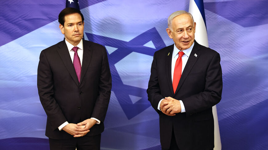 US Secretary of State Marco Rubio (L) looks on as Israeli Prime Minister Benjamin Netanyahu speaks following their meeting at the Prime Minister's office in Jerusalem on Oct. 23, 2025.