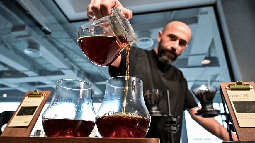 Serkan Sagsoz prepares the world's most expensive coffee