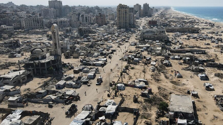 Tents sheltering displaced Palestinians in the war-damaged area surrounding Gaza City's port on October 20, 2025