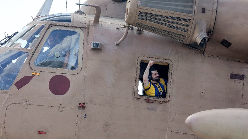 Twenty Israeli hostages such Ziv Berman, seen here celebrating aboard a military helicopter after his release, have returned alive
