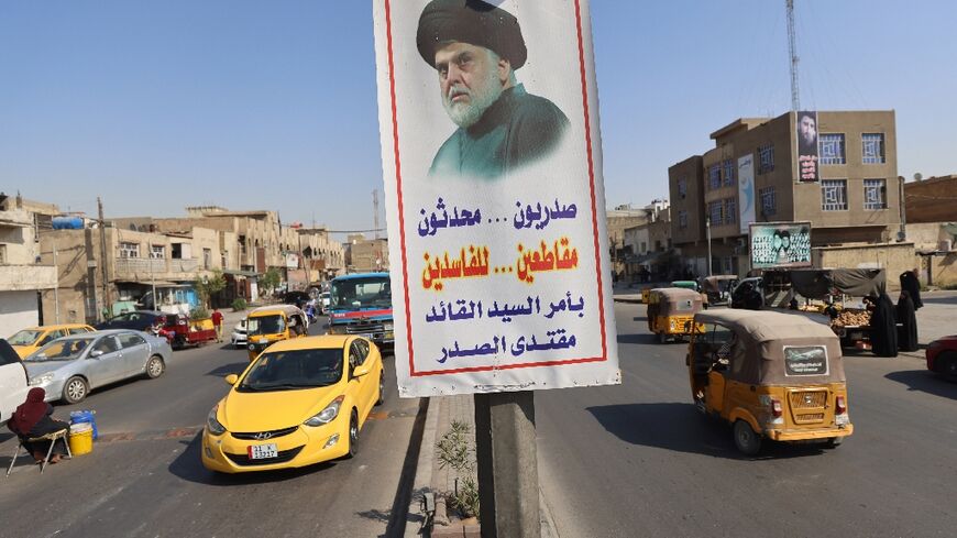 A poster flying in Baghdad's Sadr City district depicts influential Shiite cleric Moqtada Sadr and urges Iraqis to boycott parliamentary elections