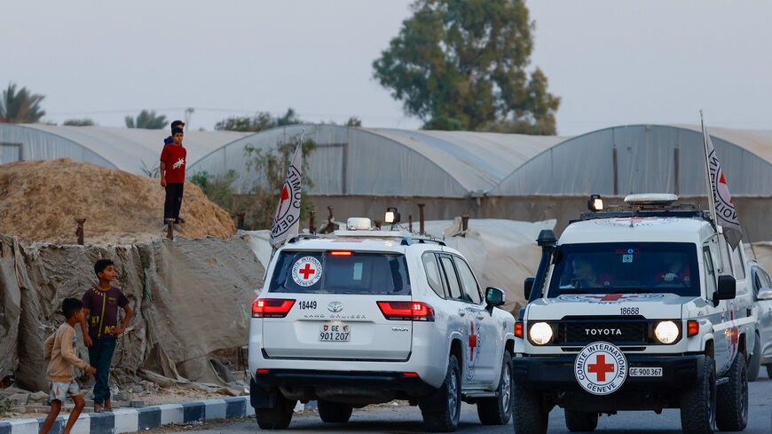 Red Cross transports the bodies of two deceased hostages, kidnapped during the October 7, 2023, attack on Israel by Hamas, after they were handed over by Hamas militants, in Deir Al-Balah, in the central Gaza Strip, October 30, 2025. REUTERS/Mahmoud Issa