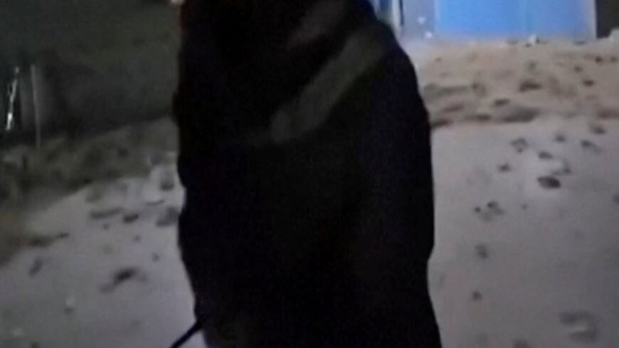 A man walks past debris lying on the ground at the shrine known as the Blue Mosque following an earthquake in Mazar-e Sharif, Afghanistan, in this still image obtained from social media video released November 3, 2025. Social Media/via REUTERS