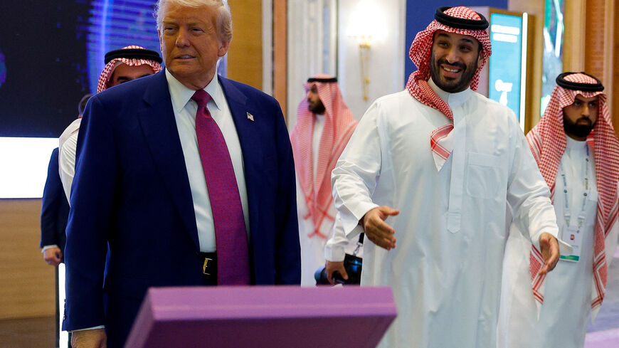 Saudi Crown Prince Mohammed Bin Salman reacts next to U.S. President Donald Trump during the Saudi-U.S. Investment Forum, in Riyadh, Saudi Arabia, May 13, 2025. REUTERS/Brian Snyder/File Photo