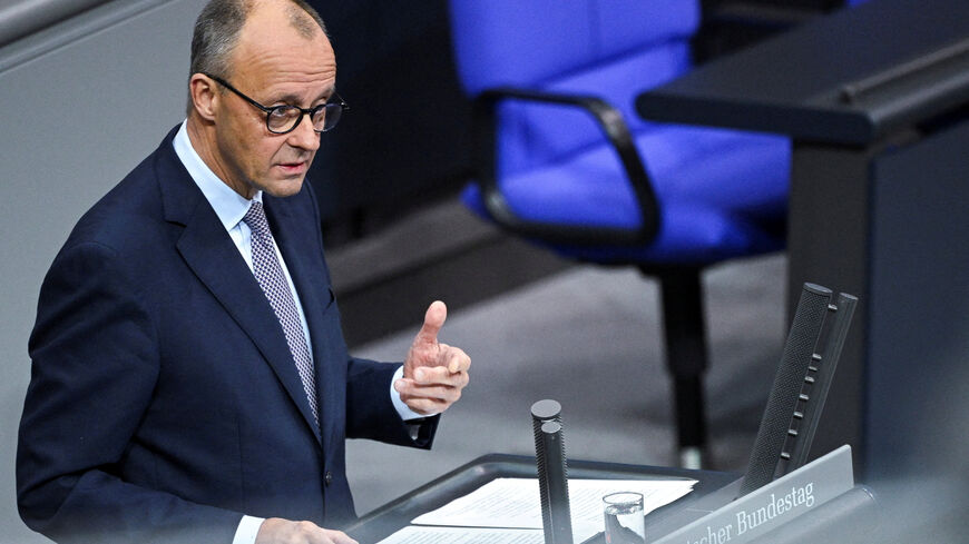 FILE PHOTO: German Chancellor Friedrich Merz delivers a government declaration on the upcoming European Council meeting with focus on EU's support for Ukraine, developments in Middle East, European defense and security, EU competitiveness, and migration during a plenum session of the lower house of parliament, the Bundestag, in Berlin, Germany October 16, 2025. REUTERS/Annegret Hilse/File Photo