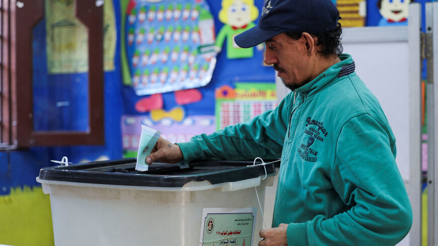 A man votes at a school used as a polling station, during the first round of Egypt's parliamentary elections, in Giza, Egypt, November 10, 2025. REUTERS/Mohamed Abd El Ghany