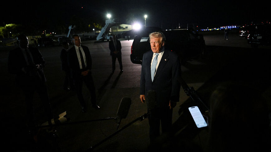 U.S. President Donald Trump speaks to members of the media at Joint Base Andrews, Maryland, U.S., November 16, 2025. REUTERS/Annabelle Gordon