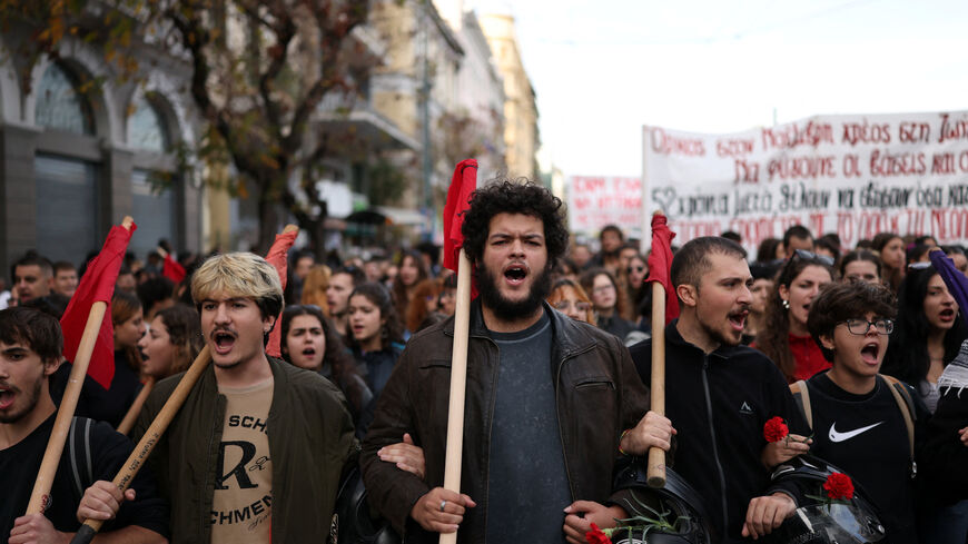 Students chant slogans during a march marking the 52nd anniversary of a 1973 student uprising against the military junta that ruled the country at the time, in Athens, Greece, November 17, 2025. REUTERS/Stelios Misinas