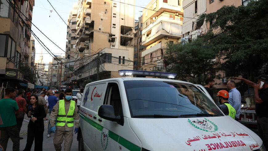 An ambulance vehicle stands near the site of an Israeli strike on a building, after Israeli military said on Sunday that it struck a militant from the Lebanese Iran-aligned Hezbollah group, in Beirut's southern suburbs, Lebanon November 23, 2025. REUTERS/Mohamed Azakir