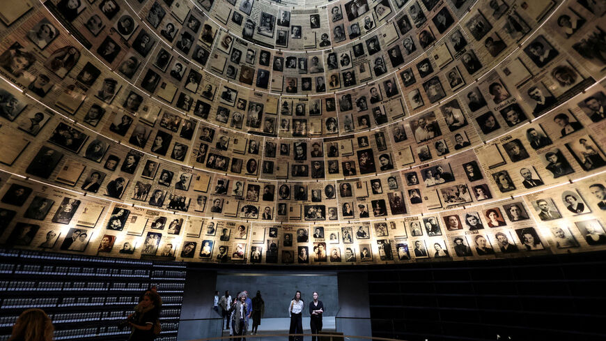 FILE PHOTO: Visitors tour an exhibition, ahead of Israel's national Holocaust memorial day at Yad Vashem, the World Holocaust Remembrance Center, in Jerusalem April 23, 2025. REUTERS/Ronen Zvulun/File Photo