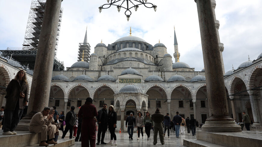 People visit the Ottoman-era Sultanahmet Mosque, known as the Blue Mosque, which Pope Leo XIV is expected to visit later this week, in Istanbul, Turkey, November 26, 2025. REUTERS/Dilara Senkaya