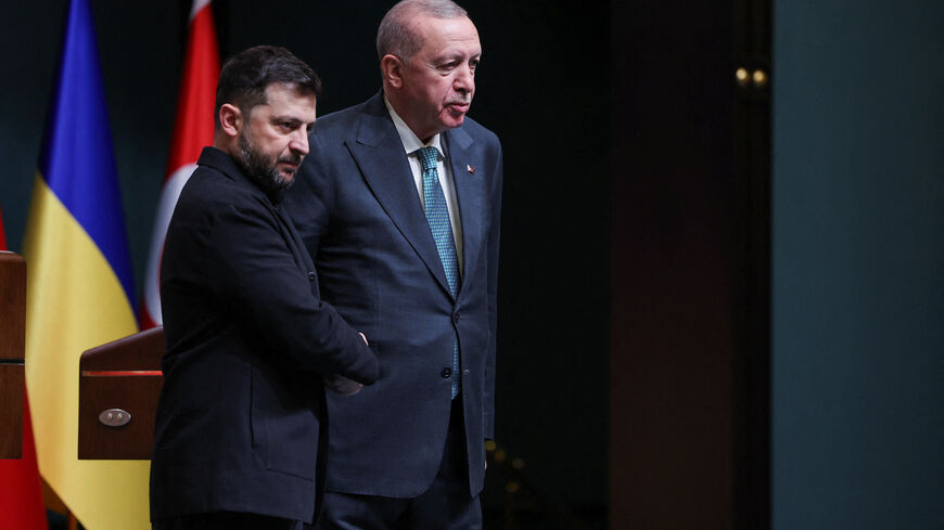 Ukrainian President Volodymyr Zelenskiy and Turkey's President Tayyip Erdogan shake hands during a joint press conference in Ankara, Turkey, November 19, 2025. REUTERS/Umit Bektas