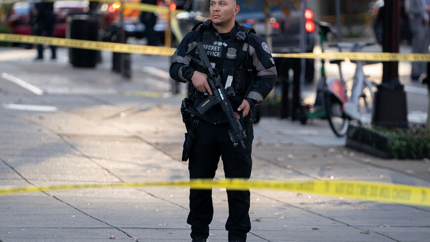 A member of the U.S. Secret Service stands guard in a cordoned-off area after two National Guard members were reportedly shot near the White House in Washington, D.C., U.S., November 26, 2025. REUTERS/Nathan Howard