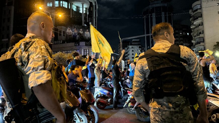 (FILES) Lebanese soldiers deploy as supporters of the militant group Hezbollah take to the streets to protest the government's endorsement of a plan to disarm the group, in Beirut's southern suburb