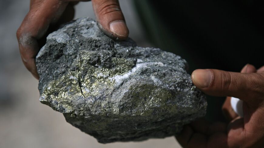 Spots of gold-rich ore speckle a stone pictured during a press tour at the Al-Amar Gold Mine, in the Riyadh region on May 28, 2008.
