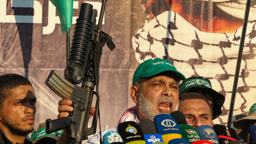 Bassam Hammoud the vice president of the Jamaa Islamiya in Lebanon, brandishes a rifle as he delivers a speech during a demonstration in Sidon in southern Lebanon on July 19, 2024, a day after an Israeli strike in the Bekaa region killed Mohammed Hamed Jabara, the commander of the Hamas-allied group in Lebanon. (Photo by Mahmoud ZAYYAT / AFP) (Photo by MAHMOUD ZAYYAT/AFP via Getty Images)
