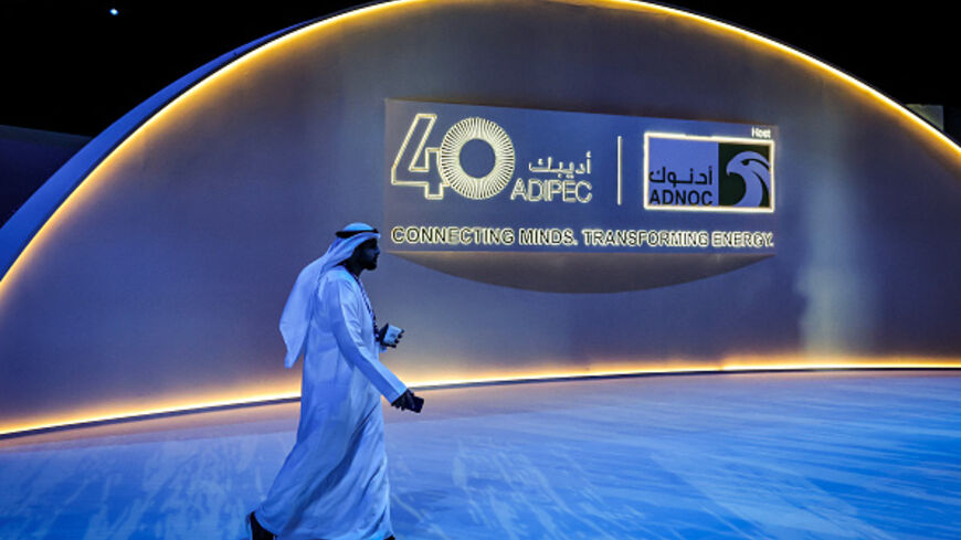 A man walks at the Abu Dhabi International Petroleum Exhibition & Conference (ADIPEC) in Abu Dhabi on November 4, 2024. (FADEL SENNA/AFP via Getty Images)