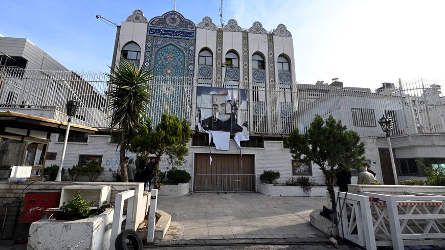A picture taken in Damascus on Dec. 9, 2024, shows the building of the Iranian Embassy, which was ransacked after anti-government fighters took the Syrian capital the previous day, with a portrait of Iran's slain Revolutionary Guards commander, Qasem Soleimani, still hanging on its fence.