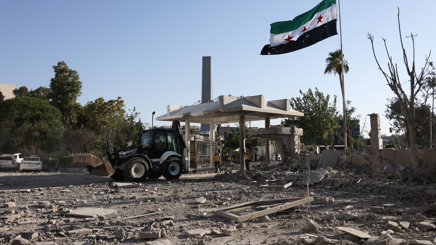 DAMASCUS, SYRIA - JULY 16: Members of Syria's civil defense work amid the aftermath of an Israeli airstrike on Syria's defence ministry headquarters on July 16, 2025 in Damascus, Syria. A spokesperson from the Israeli Defense Forces (IDF) confirmed Wednesday that Israeli airstrikes have targeted the headquarters of Syria's defence ministry and a site near the presidential palace in Damascus. The strikes come amid an escalation in conflict between Syrian government forces and Druze militia in the southern Sy