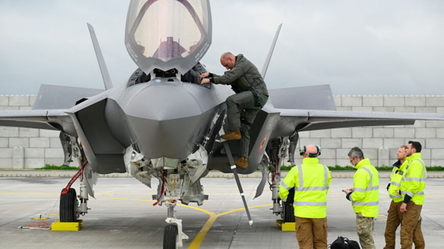 This photograph shows a pilot disembarking a Belgium's newly purchased Lockheed Martin F-35 Lightning II fighter jet for the first time, after arriving at the Florennes military airbase, southern Belgium on October 13, 2025. (Photo by JOHN THYS / AFP) (Photo by JOHN THYS/AFP via Getty Images)