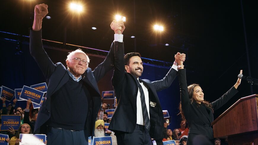 New York mayoral candidate Zohran Mamdani, center, celebrates with Sen. Bernie Sanders (I-VT), left, and US Rep. Alexandria Ocasio-Cortez (D-N.Y.), right.